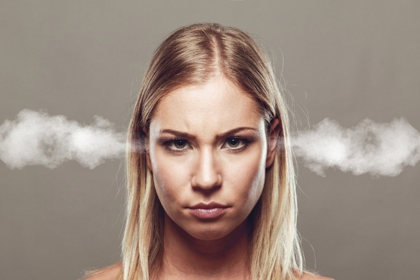 Image of a frustrated women with steam coming out of ears.